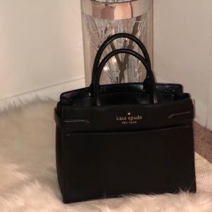 Authentic Black Kate Spade purse there’s 2 tiny white marks on bottom can’t tell